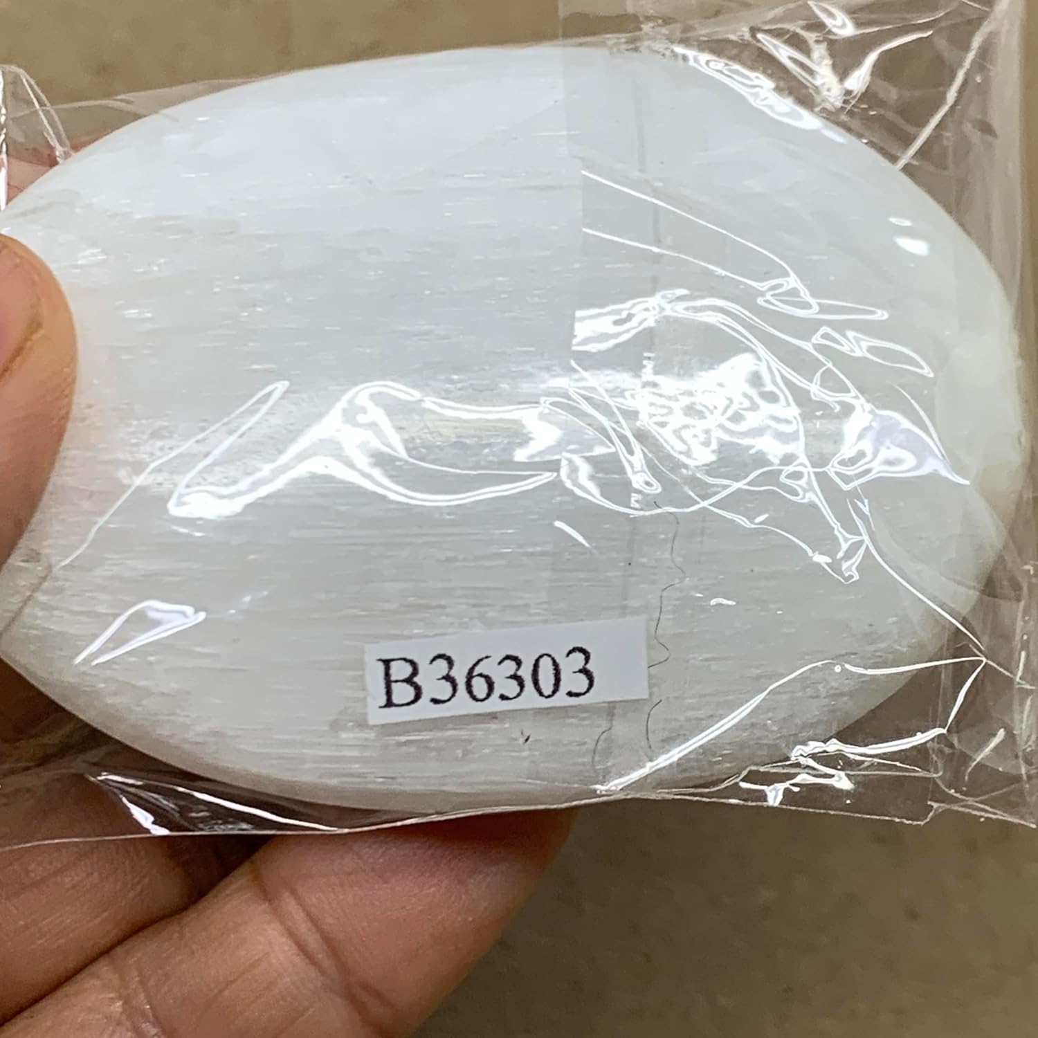WatanGems 100g Natural Selenite Palmstone Crystal Pillow Shape